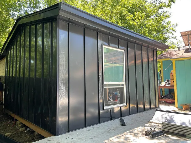 Black standing seam metal wall panels for Roof Inspection in Franconia