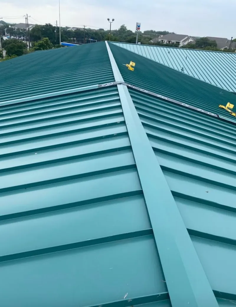 Green commercial metal roof ridge and valley for Metal Roof Repair in Franconia