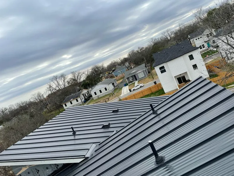 Standing seam metal roof panels with vents for Skylight Repair in Franconia
